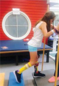 Marina Pellicciari performing physical therapy exercises.